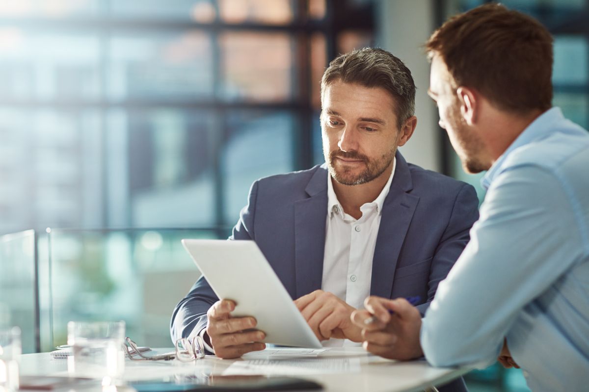 Client Speaking To His M&A Advisor Who Works At A Middle-Market Strategic M&A Advisory Firm