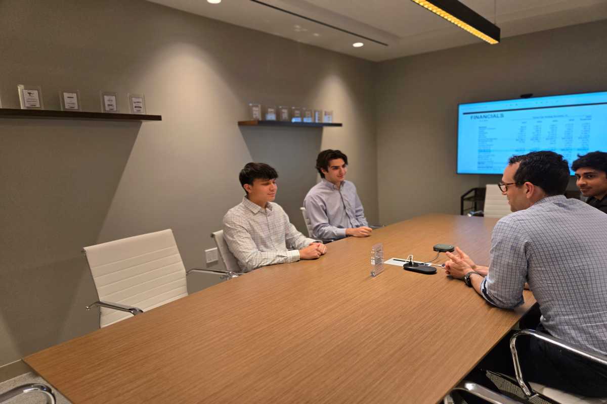 M&A Advisors Discussing Financial Strategy in a Meeting