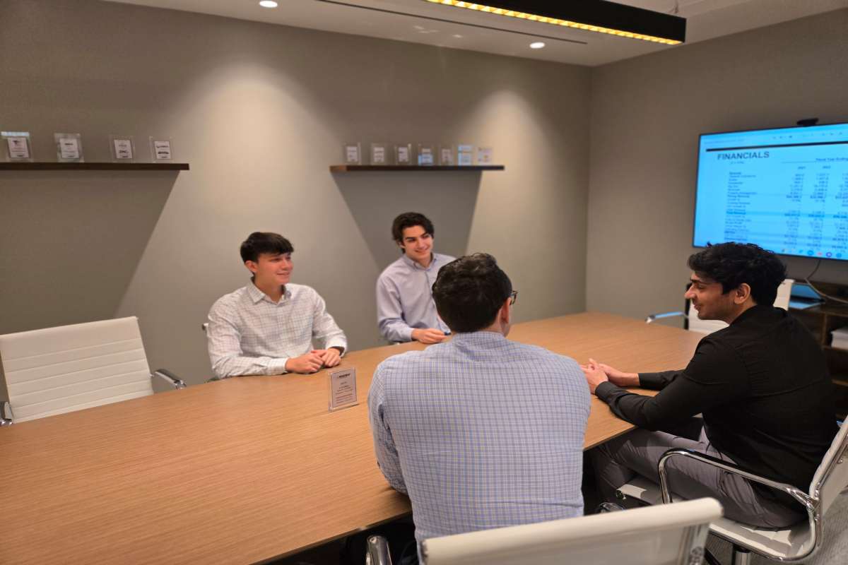 M&A Advisors Discussing Sell Side Business Growth in Meeting