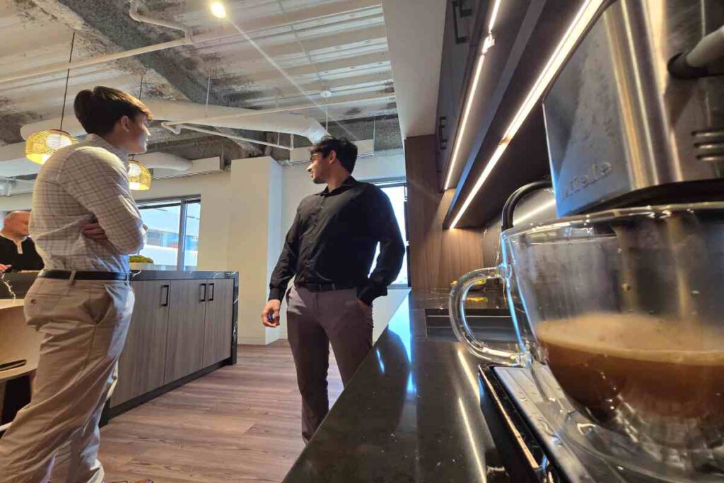 M&A Advisors Discussing Valuation Process in Office Canteen