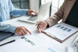 Buyers Checking Financial Statements of A Paving Company