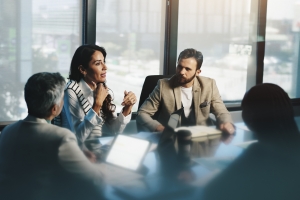 Professionals Discussing Buyer Universe Strategy for Business